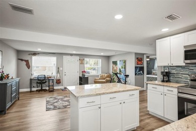 Come check out this gorgeous updated waterfront pool home - photo 4
