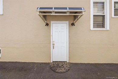Welcome to this beautifully maintained detached two-family home - photo 3
