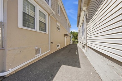 Welcome to this beautifully maintained detached two-family home - photo 4