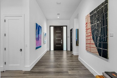 A single-story masterpiece unfolds in the prestigious Royal Palm - photo 8