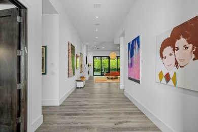 A single-story masterpiece unfolds in the prestigious Royal Palm - photo 9