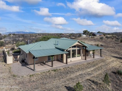 Imagine living in a Sonoita hilltop oasis studded with live oak