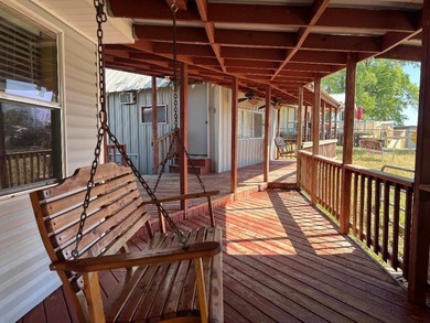 Two deeded waterfront lots on Lake Murvaul. Two homes. The - photo 13