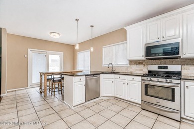 Welcome to this well maintained two-family detached side hall - photo 14
