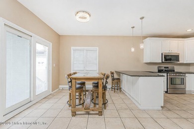 Welcome to this well maintained two-family detached side hall - photo 15