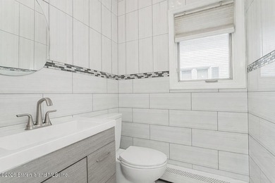 Welcome to this well maintained two-family detached side hall - photo 16