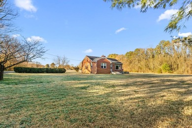 Cozy well-built Brick Rancher on tucked away 1.06 Acres in the