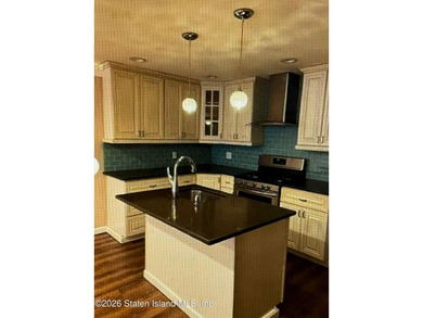 Welcome to this well maintained two-family detached side hall - photo 34