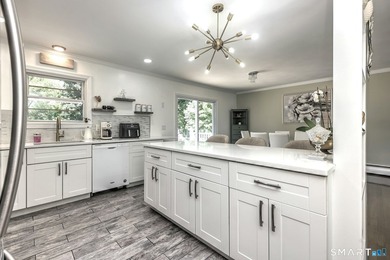 Welcome to this beautiful raised ranch located on a quiet street - photo 18
