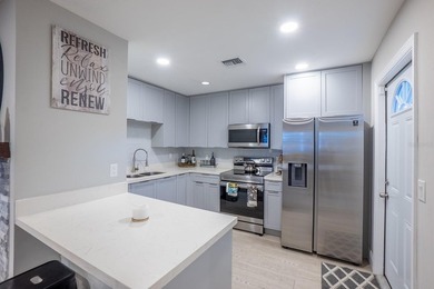 This updated and fully furnished Daytona Beach duplex offers a - photo 3