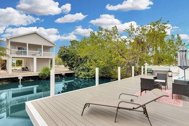 This three bedroom , two bathroom home sits on an expansive 12 - photo 3