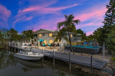 This three bedroom , two bathroom home sits on an expansive 12 - photo 5