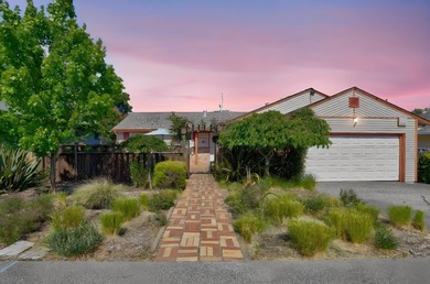 Tucked behind a charming brick-enclosed patio, this 3 bedroom - photo 2