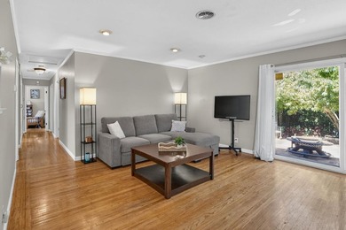 Tucked behind a charming brick-enclosed patio, this 3 bedroom - photo 3