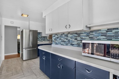 Tucked behind a charming brick-enclosed patio, this 3 bedroom - photo 9