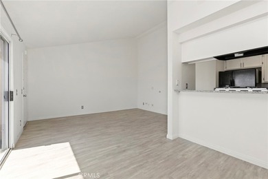 Welcome to this bright and inviting top-floor condominium in one - photo 7