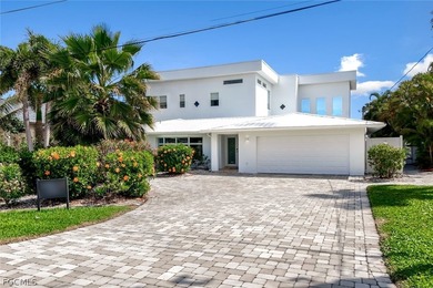 Discover this unique and elegant 2-story waterfront mansion in - photo 11