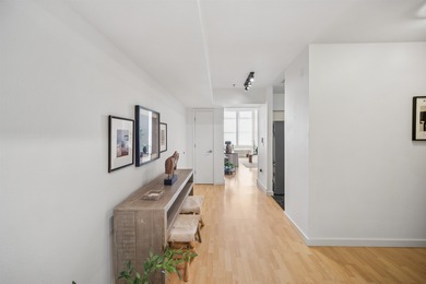 Welcome to Midtown Lofts! This chic, two-story condo unit boasts