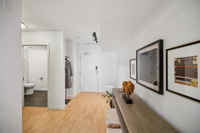 Welcome to Midtown Lofts! This chic, two-story condo unit boasts