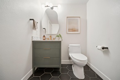 Welcome to Midtown Lofts! This chic, two-story condo unit boasts