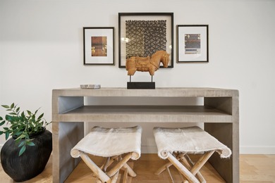 Welcome to Midtown Lofts! This chic, two-story condo unit boasts