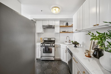 Welcome to Midtown Lofts! This chic, two-story condo unit boasts