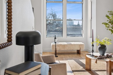 Welcome to Midtown Lofts! This chic, two-story condo unit boasts