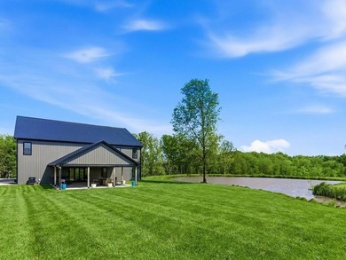 Tucked behind a grove of mature trees, this 4-bedroom - photo 1