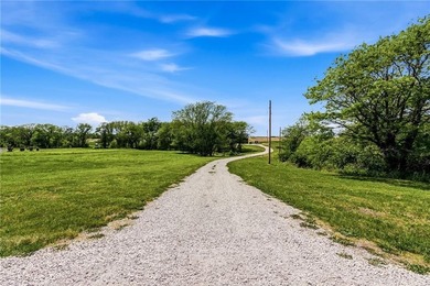 Tucked behind a grove of mature trees, this 4-bedroom - photo 2