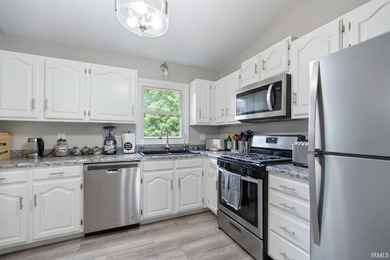 Step inside this beautifully updated split-level home where - photo 9