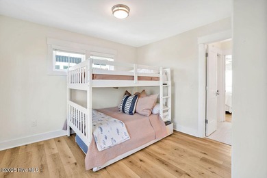 Welcome to 1408 E Beach Drive, where every sunrise feels close