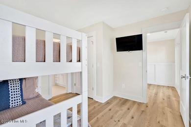 Welcome to 1408 E Beach Drive, where every sunrise feels close