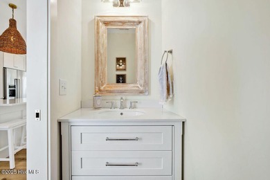 Welcome to 1408 E Beach Drive, where every sunrise feels close