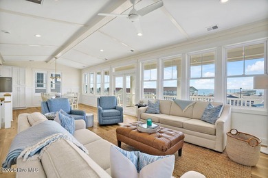 Welcome to 1408 E Beach Drive, where every sunrise feels close