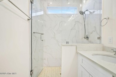 Welcome to 1408 E Beach Drive, where every sunrise feels close