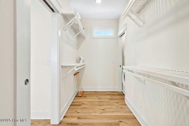 Welcome to 1408 E Beach Drive, where every sunrise feels close