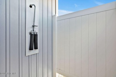 Welcome to 1408 E Beach Drive, where every sunrise feels close