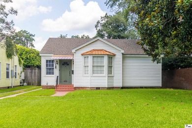 Welcome to this charming 3-bedroom, 2-bath home nestled in the - photo 1