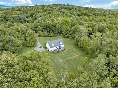 Don't miss this 3-bedroom, 2.5-bath Cape Cod on 0.6 acres - photo 2