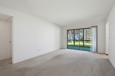 This 2 bedroom, 2 bathroom first floor condo is conveniently - photo 2