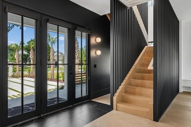Modern coastal luxury awaits at 4017 Kaolin Street, a - photo 9