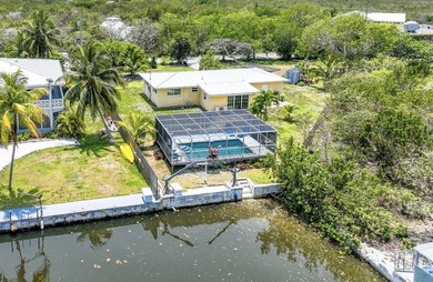 Nestled in the heart of Big Pine Key, this private canal-front - photo 3