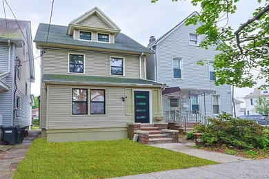 Welcome to this beautiful renovated single-family home in the - photo 2