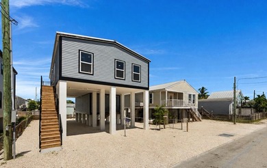This newly built 2026 home on Stock Island delivers what buyers - photo 1