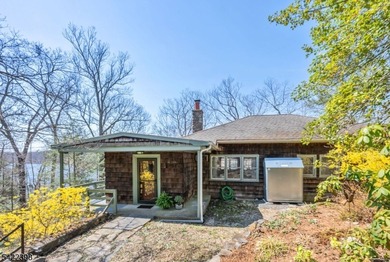 Escape to this idyllic lake front home offering breathtaking - photo 3