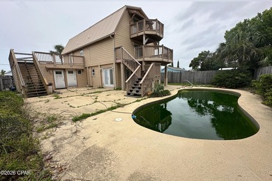 This three-story elevated beach house features 4 bedrooms, 3 - photo 13