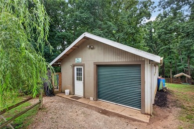 Tucked away on 9.98 secluded acres, this 3 bedroom, 1 bath home - photo 26