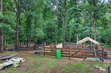 Tucked away on 9.98 secluded acres, this 3 bedroom, 1 bath home - photo 29