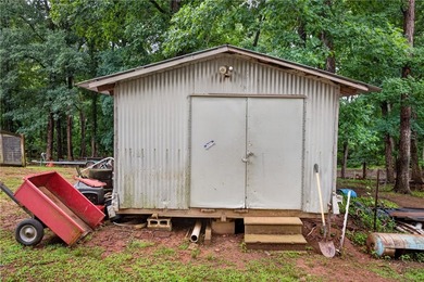 Tucked away on 9.98 secluded acres, this 3 bedroom, 1 bath home - photo 31
