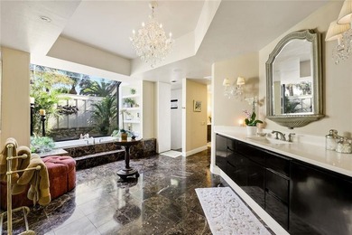 Set across two private, meticulously landscaped lots inside the - photo 24
